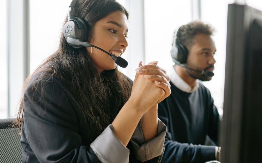 Account team taking customer calls with headsets