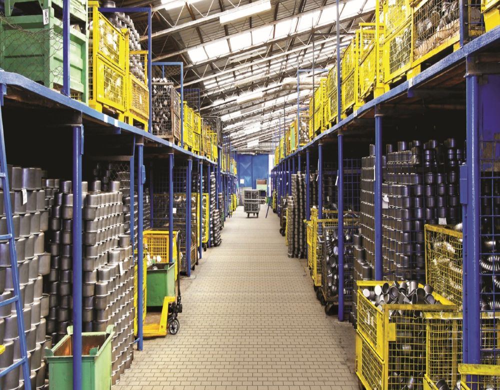 Warehouse staff moving stock with a pallet trolley